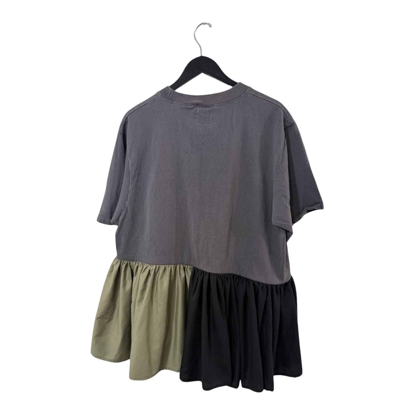 0 mph charcoal grey cotton t-shirt with olive and black asymmetrical ruffled hem on a black hanger.
