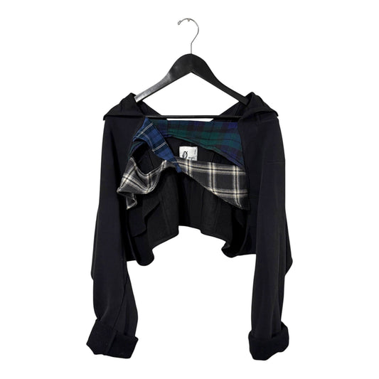 0 mph black cropped layered jacket with deconstructed plaid interior detailing on a hanger.