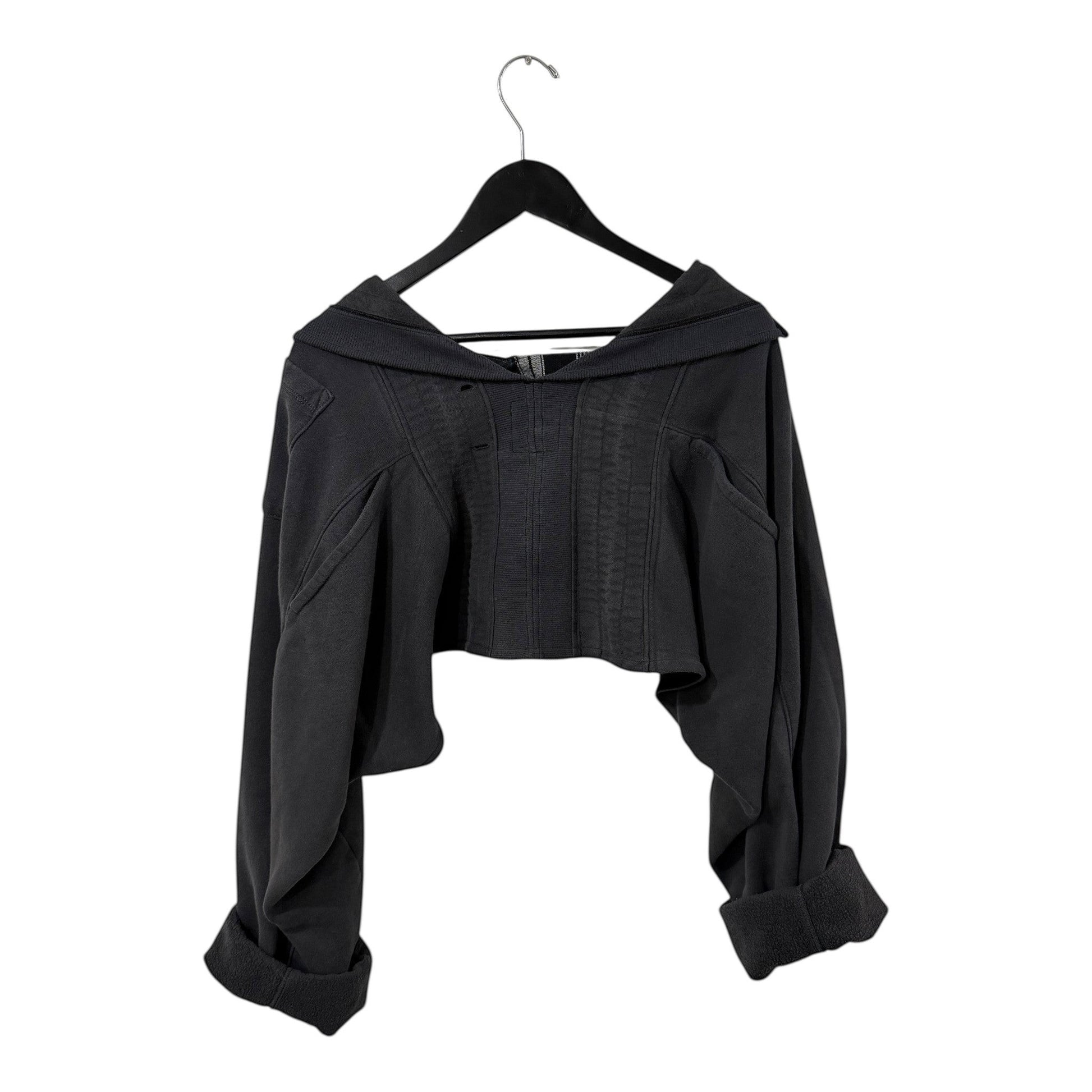 0 mph charcoal grey deconstructed cropped sweatshirt with corset-style bodice and voluminous sleeves on a hanger.