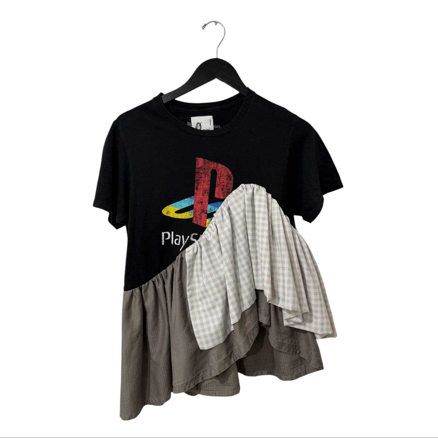 0 mph upcycled black graphic t-shirt with vintage PlayStation logo and asymmetrical gingham ruffle hem.