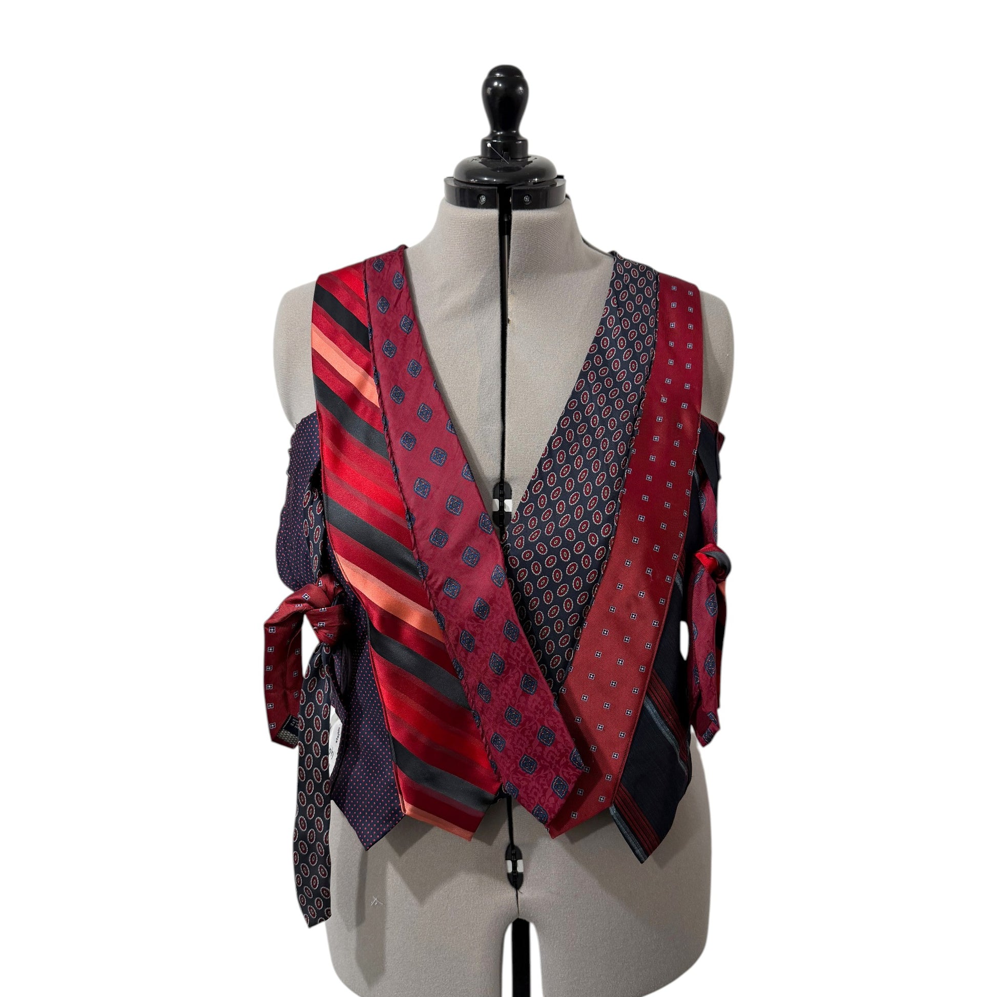 0 mph upcycled corset top made from patchwork red and navy neckties with a V-neck and adjustable side tie closures.