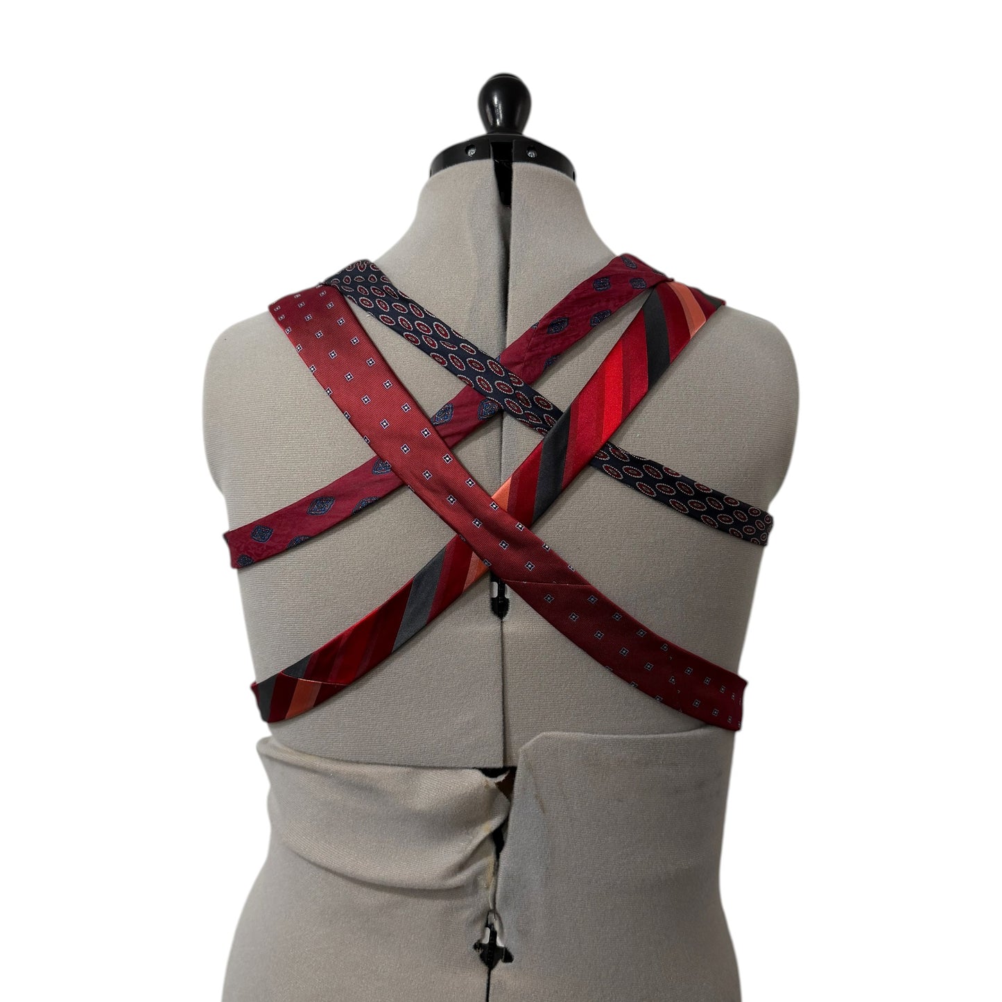 0 mph upcycled corset top featuring a crisscross back made from vintage red, burgundy, and navy patterned neckties.