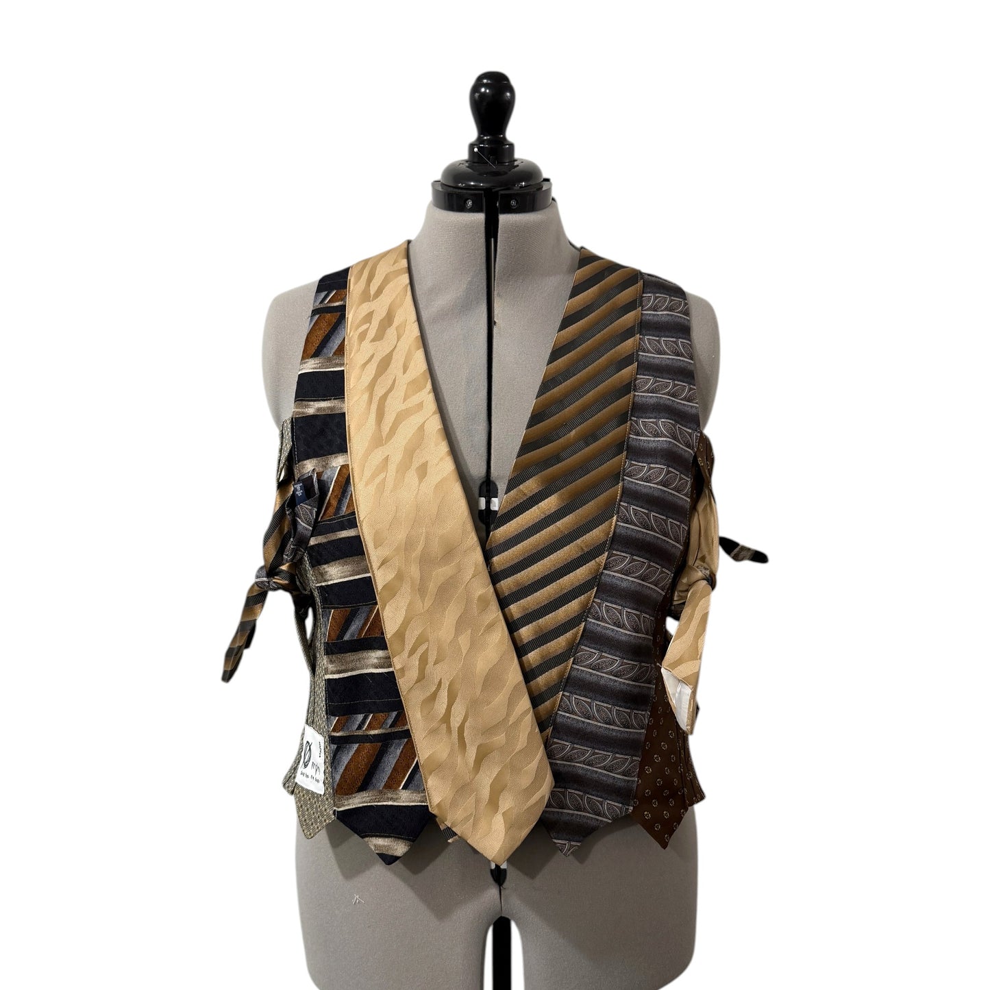 0 mph upcycled patchwork vest made from silk neckties in earthy brown, black, and gold tones with side-tie closures.