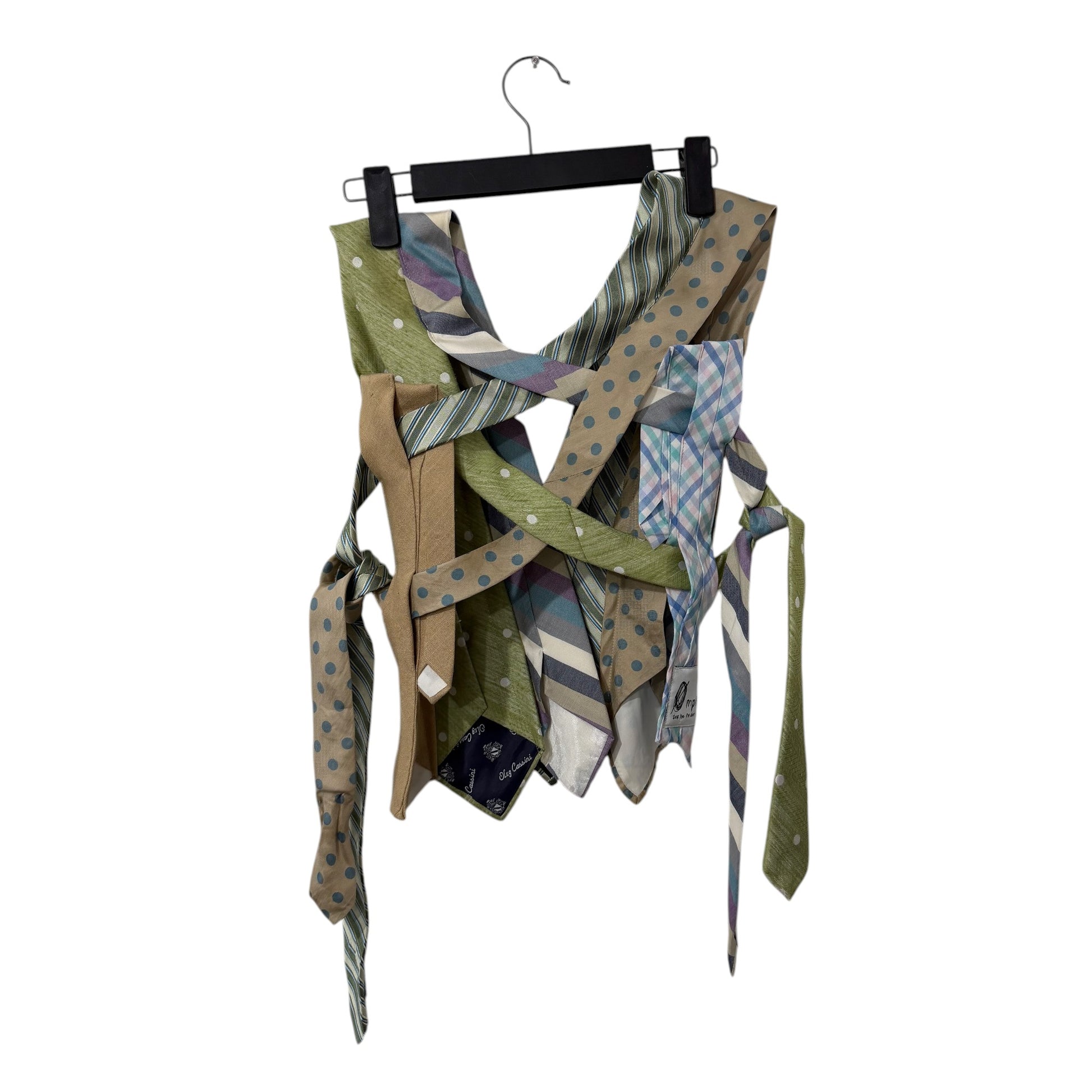0 mph upcycled necktie vest in sage green, tan, and blue with polka dot, stripe, and plaid patterns.